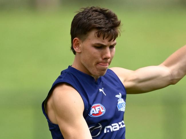 MELBOURNE, AUSTRALIA - DECEMBER 09: Finn O'Sullivan of the Kangaroos kicks during a North Melbourne Kangaroos AFL training session at Arden Street Ground on December 09, 2024 in Melbourne, Australia. (Photo by Quinn Rooney/Getty Images)