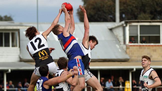 Ovens & King Football League 2nd Semi Final between Tarrawingee and Benalla. Benalla 17.11 (113) defeated Tarrawingee 14.6 (90). Tarrawingee star forward Justin Hoggan hauls in a big pack mark against Benalla All Blacks. Picture: Aaron Cook