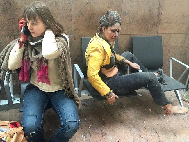 Getty Images Year in Focus 2016: Flight attendant Nidhi Chaphekar (R) reacts in the moments following a suicide bombing at Brussels Zaventem airport on March 22, 2016 in Brussels, Belgium. Georgian journalist Ketevan Kardava, special correspondent for the Georgian Public Broadcaster, was travelling to Geneva when the attack took place, she was knocked to the floor and began to take photographs in the moments that followed. At least 31 people were killed and more than 260 injured in a twin suicide blast at Zaventem Airport and a further bomb attack at Maelbeek Metro Station. Two brothers are thought to have carried out the attacks and a manhunt is underway for a third suspect. Photo by Ketevan Kardava/Getty Images