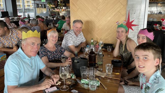 (L-R) Peter and Pauline Birch, Cameron, Sarah, Annabella and Alex Tyrrell enjoying Christmas Day at Wharf One in Darwin, 2022. Picture: Annabel Bowles