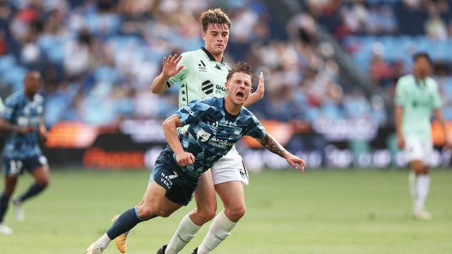 SYDNEY, AUSTRALIA – DECEMBER 14: Adrian Segecic of Sydney FC is tackled by Dylan Leonard of Western United during the round eight A-League Men match between Sydney FC and Western United at Allianz Stadium, on December 14, 2024, in Sydney, Australia. (Photo by Matt King/Getty Images)