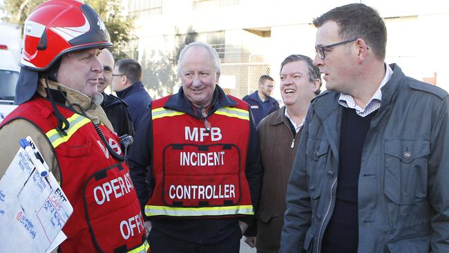 Premier Daniel Andrews talks with firefighters. Picture: David Crosling