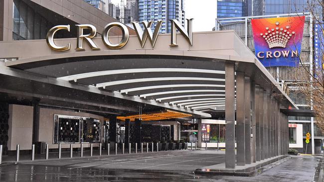 The entrance to the Crown Casino lies empty in Melbourne on August 19, 2020 as its parent company Crown Resorts recorded a full-year net profit fall of 80 percent due to a COVID-19 coronavirus forced closure. (Photo by William WEST / AFP)