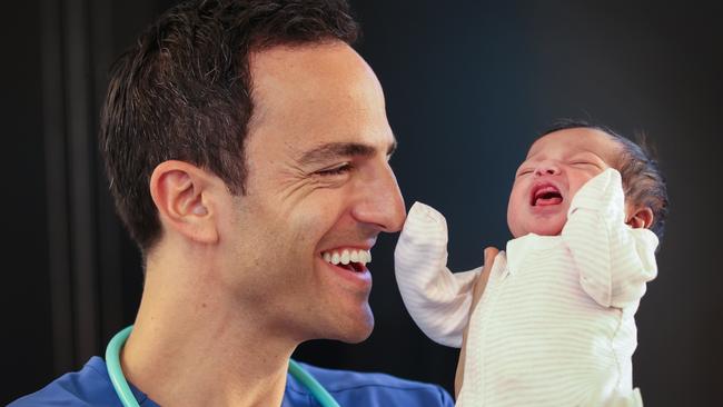 Dr Daniel Golshevsky settles new born baby Mikaylah at Cabrini Mother and Baby Centre Malvern. Picture: David Caird