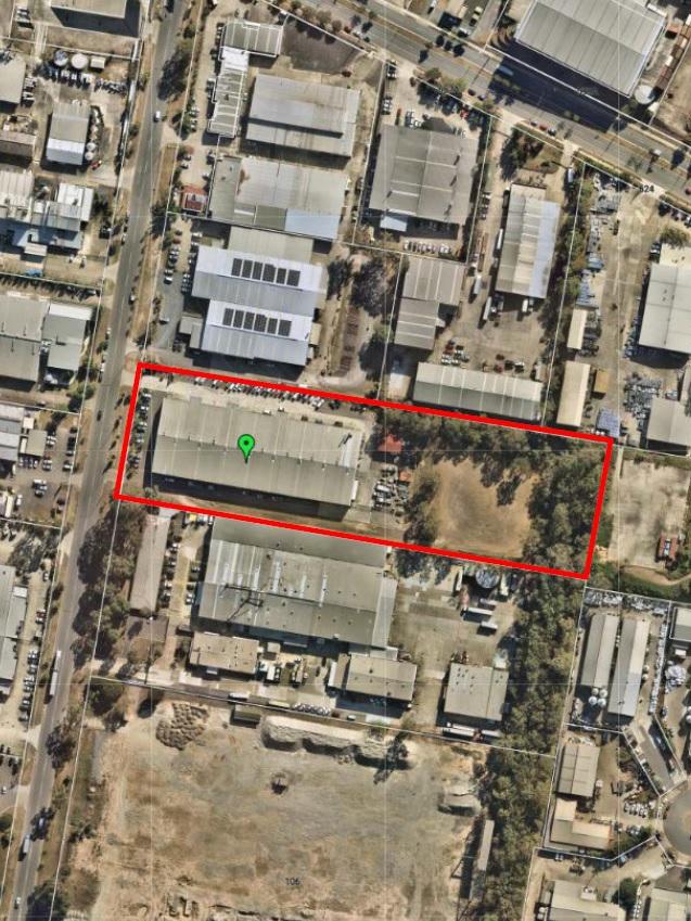 An aerial photograph of the site where the centre will be built. The current lot is leased by the Brisbane City Council to maintain their vehicle fleet.