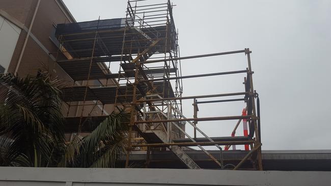 Nepean Hospital had to close the catheterisation (cath) lab after the ceiling was deemed unsafe. Now construction taking place to fix it. Pictured is the scaffolding reaching up to the fifth level cath lab on the west block building, above the emergency department.