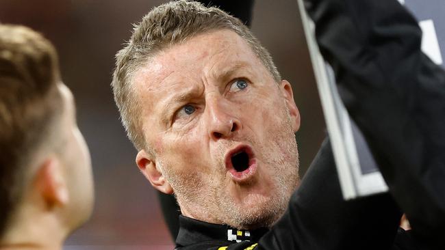 MELBOURNE, AUSTRALIA - MAY 20: Damien Hardwick, Senior Coach of the Tigers addresses his players during the 2023 AFL Round 10 match between the Essendon Bombers and the Richmond Tigers at the Melbourne Cricket Ground on May 20, 2023 in Melbourne, Australia. (Photo by Michael Willson/AFL Photos via Getty Images)