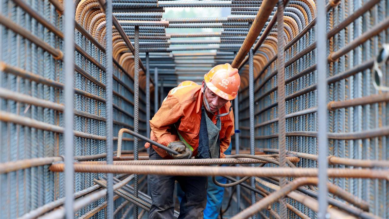 A worker prepares steel bars on the construction site of the Zhangjinggao Yangtze River Bridge on Mazhou Island in Jingjiang. Picture: AFP