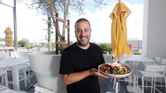 Owner Simon Gloftis with a fresh Greek salad at Bar Hellenika, Nobby Beach. Photo by Richard Gosling