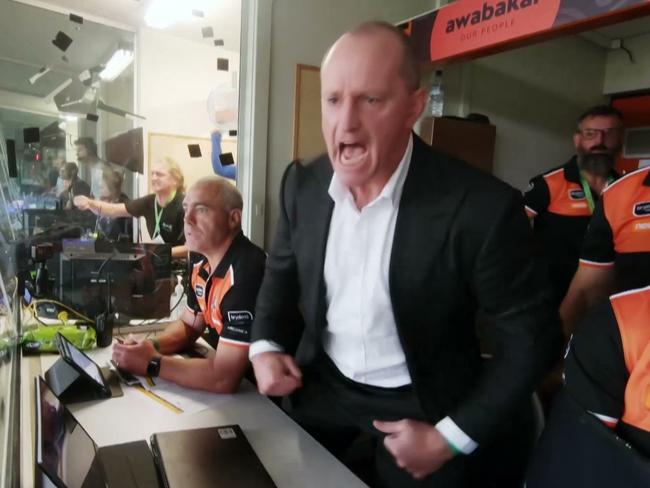 Wests Tigers coach Michael Maguire gets fired up in the coach’s box.