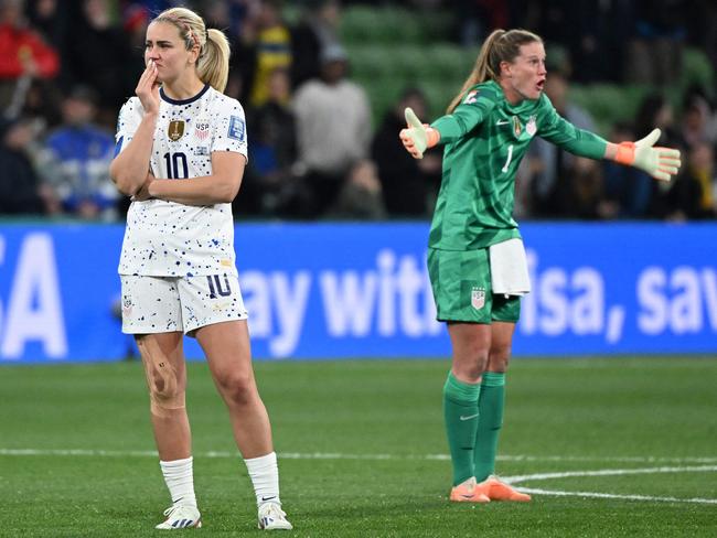 Lindsey Horan (left) and goalkeeper Alyssa Naeher react after the US loss to Sweden. (Photo by WILLIAM WEST / AFP)