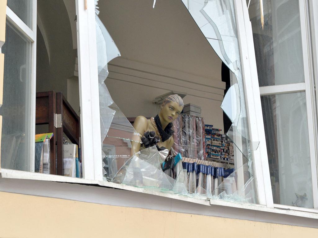 A mannequin hangs out of a broken window of a shop after the shelling by Russian forces of Constitution Square in Kharkiv, Ukraine's second-biggest city. Picture: AFP