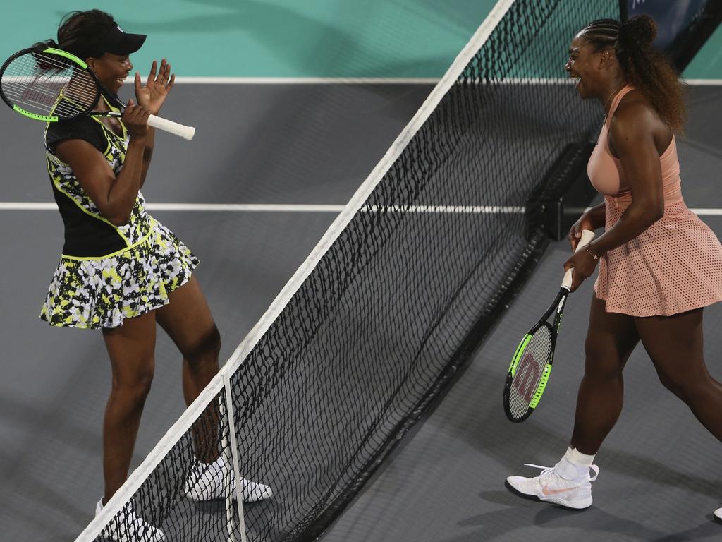 Venus celebrates after defeating her sister Serena, in a match in Abu Dhabi. Picture: AP