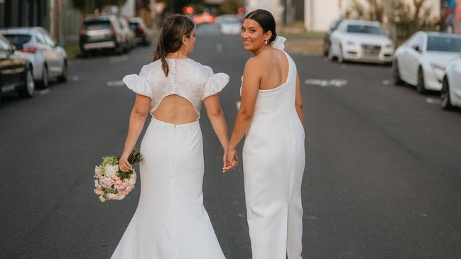 Nothing could stop the union of beautiful brides Eliza Gleadell and Sarah Walsh. Picture: Corey Wright