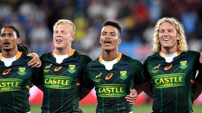 The South African rugby team embrace for their national anthem before the 2020 Sydney Sevens Men’s Finals. Picture: Bradley Kanaris/Getty Images