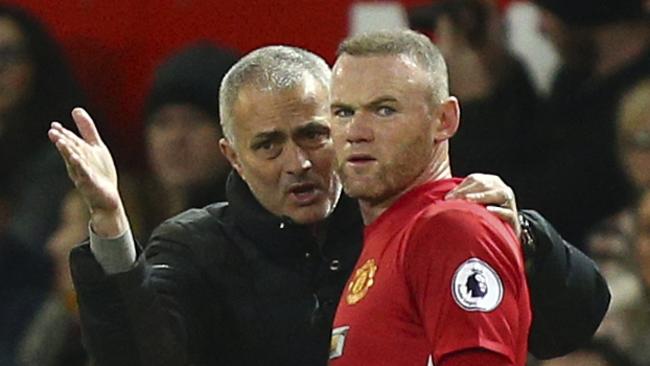 Manchester United manager Jose Mourinho talks to Manchester United's Wayne Rooney.