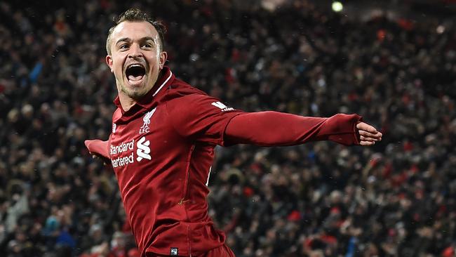 Liverpool's Swiss midfielder Xherdan Shaqiri celebrates after scoring their third goal during the English Premier League football match between Liverpool and Manchester United at Anfield in Liverpool, north west England on December 16, 2018. (Photo by Paul ELLIS / AFP) / RESTRICTED TO EDITORIAL USE. No use with unauthorized audio, video, data, fixture lists, club/league logos or 'live' services. Online in-match use limited to 120 images. An additional 40 images may be used in extra time. No video emulation. Social media in-match use limited to 120 images. An additional 40 images may be used in extra time. No use in betting publications, games or single club/league/player publications. /