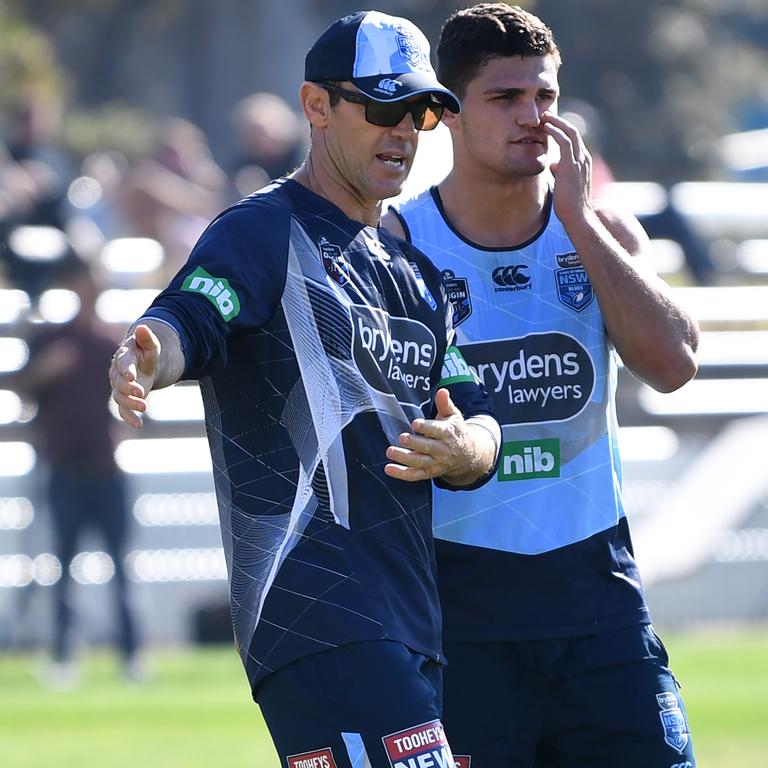 Blues boy ... Nathan with NSW head coach Brad Fittler during a training session at Coogee Oval in Sydney, May 2018.