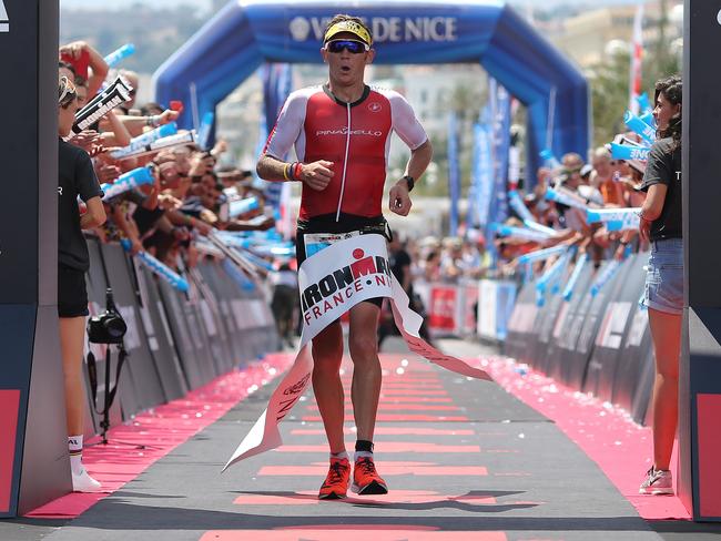 Cameron Wurf croisses the finish line in third place at Ironman Nice, France, in June. Picture: Nigel Roddis/Getty