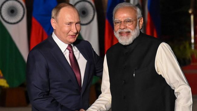 Prime Minister Narendra Modi, right, greets Russian President Vladimir Putin before a meeting at Hyderabad House in New Delhi on December 6, 2021. Picture: Money Sharma/AFP