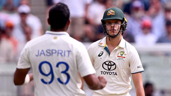 Australian batsman Sam Konstas (R) looks at India's Jasprit Bumrah (L) on the first day of the fourth cricket Test match between Australia and India at the Melbourne Cricket Ground (MCG) in Melbourne on December 26, 2024. (Photo by William WEST / AFP) / --IMAGE RESTRICTED TO EDITORIAL USE - STRICTLY NO COMMERCIAL USE--