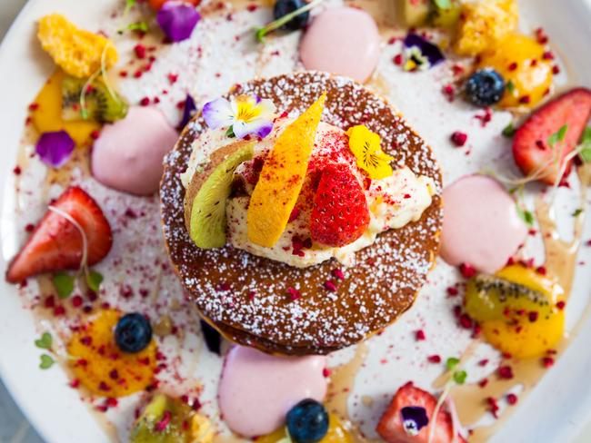 White Mojo’s buttermilk strawberry pancake, filled with strawberry crème chantilly, topped with vanilla ricotta, lemon cured, maple syrup, fresh and freeze dried fruit and a white chocolate crumb. Picture: Supplied