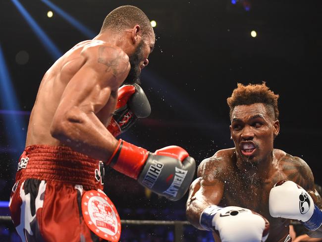 Charlo (right) attacks Julian Williams in their fight in Los Angeles in 2016. Photo: Jayne Kamin-Oncea/Getty Images