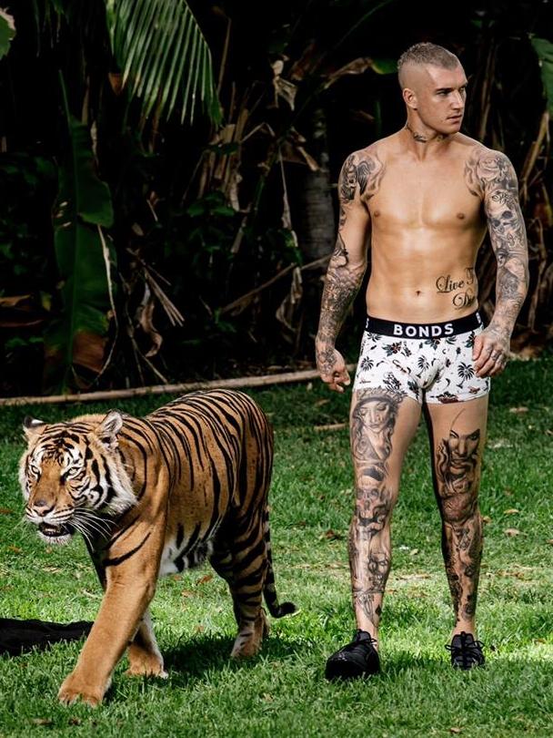 Dustin Martin and Pi the tiger behind the scenes for the Bonds campaign. Picture: Facebook