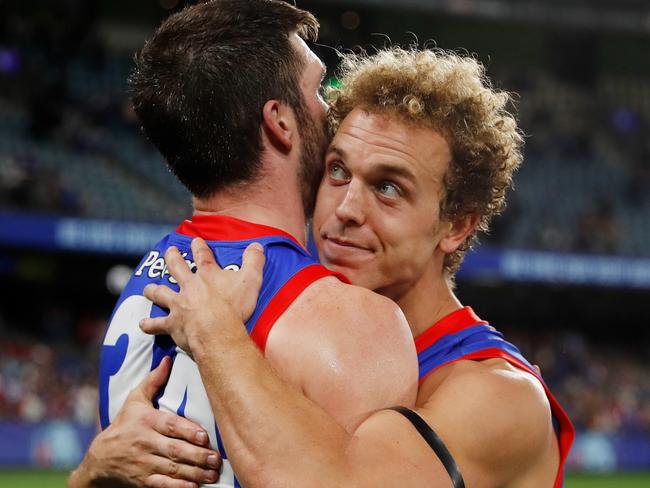 Bailey Williams and Mitch Wallis embrace after the win over Essendon. Picture: AFL Photos/Getty Images