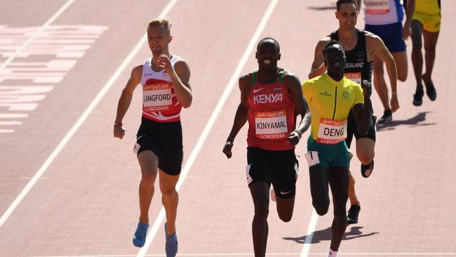 Joeseph Deng of Australia (right) finishes third in his 800m heat, earning a spot in the final. Photo: AAP