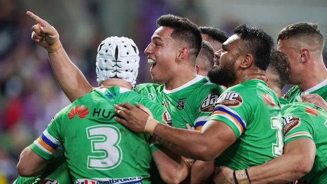 Raiders players celebrate John Bateman’s matchwinning try against the Storm. Picture: AAP