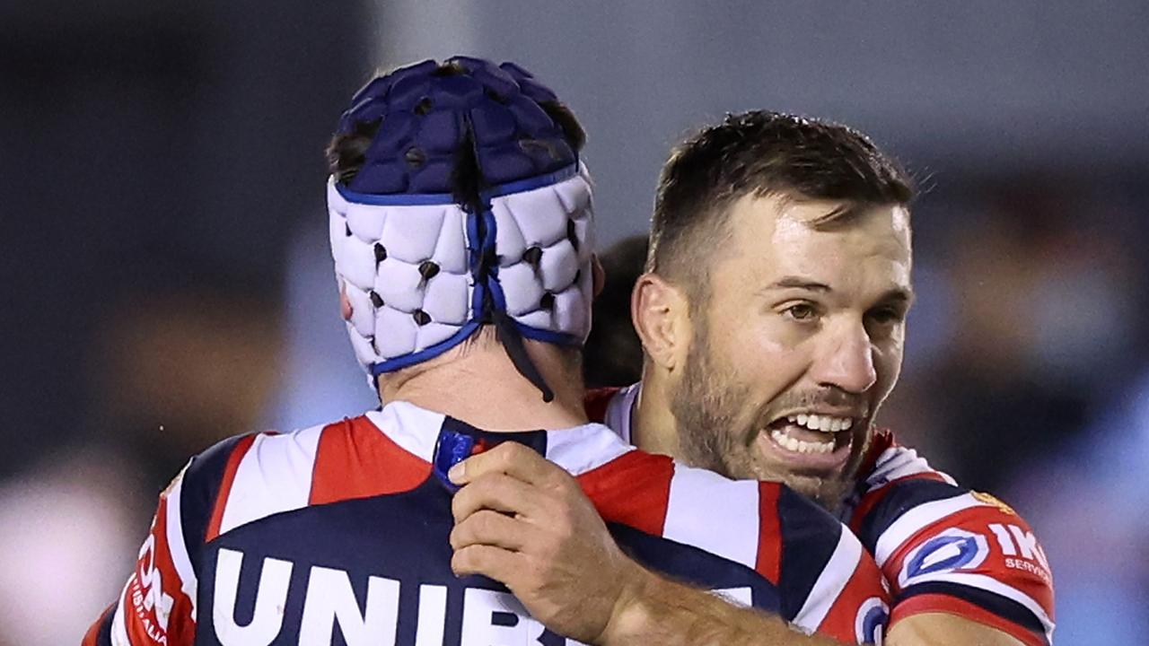 James Tedesco and Luke Keary embrace after the undermanned Roosters knocked the Sharks out of the finals last year. Picture: Mark Metcalfe/Getty Images