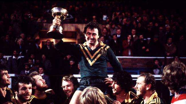 Australia's rugby league team celebrate as Max Krillich holds up a trophy for the 1982 Kangaroos. Pic Brisbane Sun. (No details as to which game this is. The image was dated 22/12/1982 but the Kangaroos tour was over by then.)