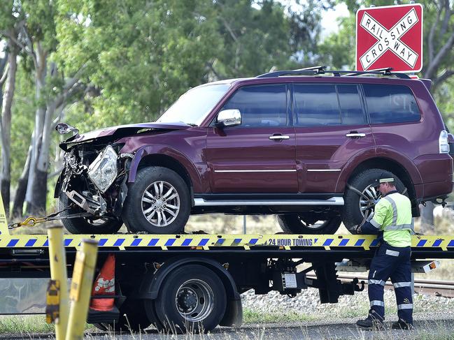 A four-wheel-drive towing a trailer had its front end smashed after it collided with a freight train pulling 28 carriages near Alligator Creek Road. PICTURE: MATT TAYLOR.