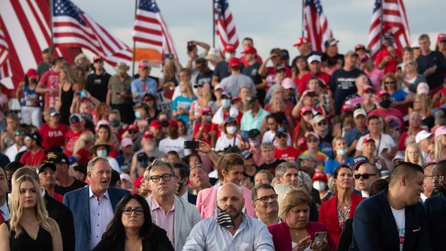 Supporters of US President Donald Trump attend a rally as he campaigns at Orlando Sanford International Airport in Florida. Picture: AFP