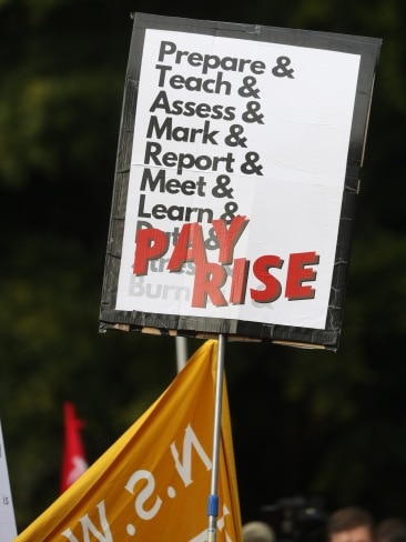 Teachers held banners and posters throughout the demonstration in various locations around NSW. Picture: John Grainger