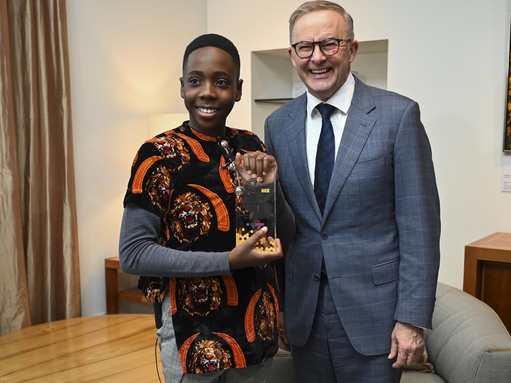 CANBERRA, AUSTRALIA - NOVEMBER 21: The three national winners of the 2022 Prime Minister's Spelling Bee meet with  the Prime Minister Anthony Albanese at Parliament House in Canberra. Ozi Egesi with the Prime Minister Anthony Albanese. Picture: NCA NewsWire / Martin Ollman