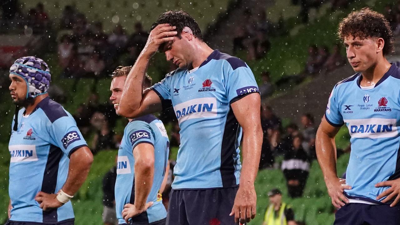 Rob Simmons and Waratahs players look on following a Rebels try at AAMI Park.