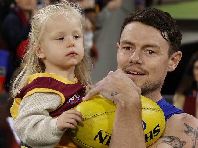 MELBOURNE , AUSTRALIA. April 11, 2024.  AFL . Round 5 . Melbourne vs Brisbane at the MCG.   Lachie Neale of the Lions  comes out for game 250 with his daughter   . Pic: Michael Klein