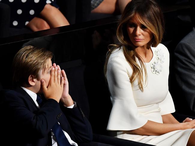 Barron Trump and Melania Trump listen to the Donald at Quicken Loans Arena.