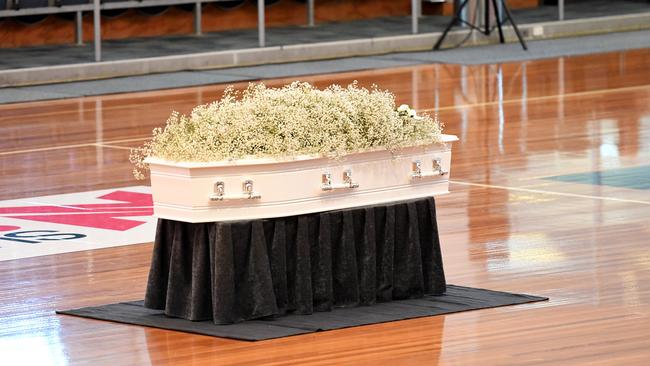 Sophia’s casket sits on the netball court during Friday’s service. Photo: Tricia Watkinson.