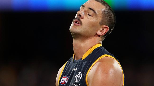 Taylor Walker reacts to a poster with his kick at goal. Picture: Sarah Reed/AFL Photos via Getty Images