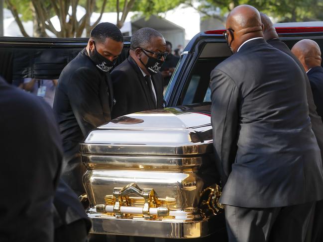 George Floyd's coffin is loaded into a hearse after being brought out of Fountain of Praise church following a public visitation. Picture: AP