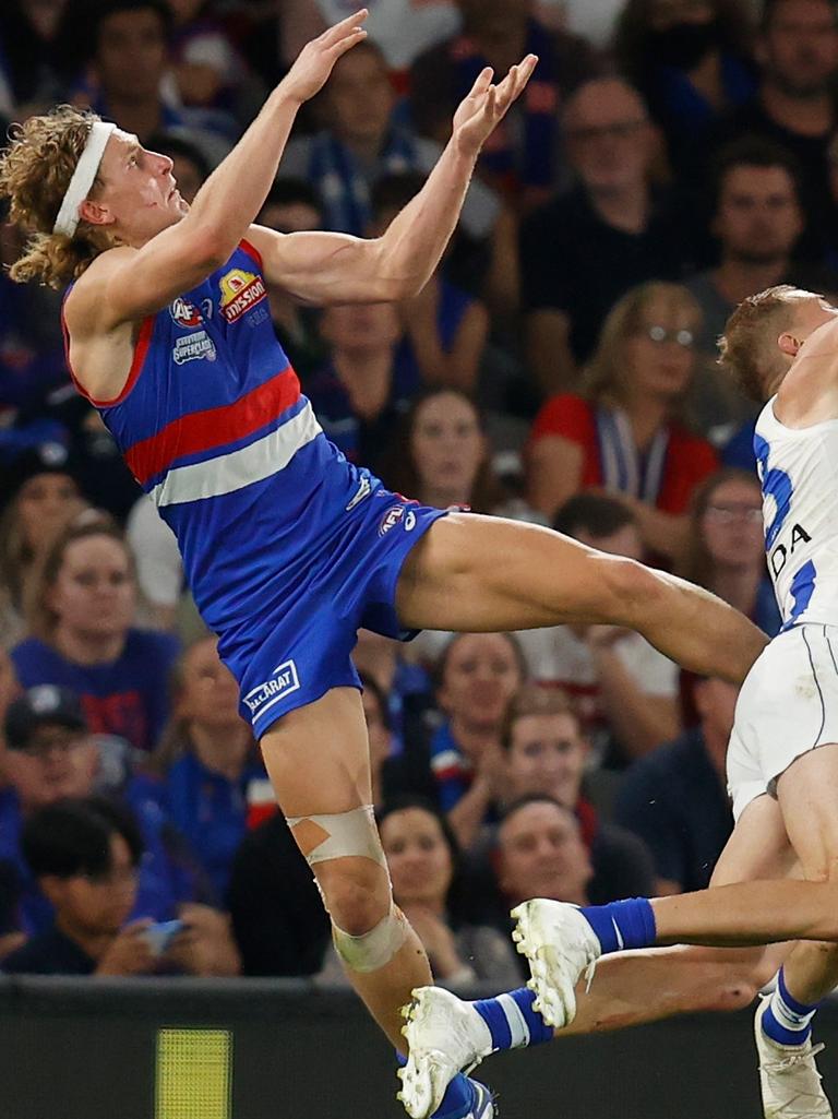 Aaron Naughton takes a high mark over Ben McKay. Picture: AFL Photos via Getty Images