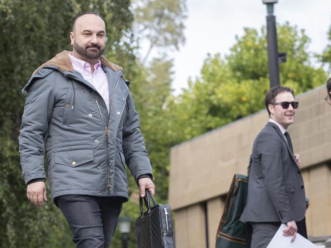 Moe Sultan, left, after his Supreme Court win on Wednesday, with lawyer Nathan Munting. Picture: Chris Kidd