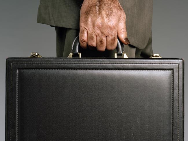 Man with suitcase. Hand holding briefcase. 0541654 001