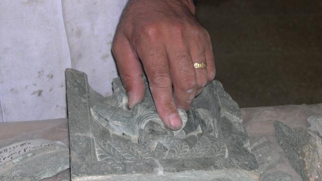 One of the earthenware fragments under repair.