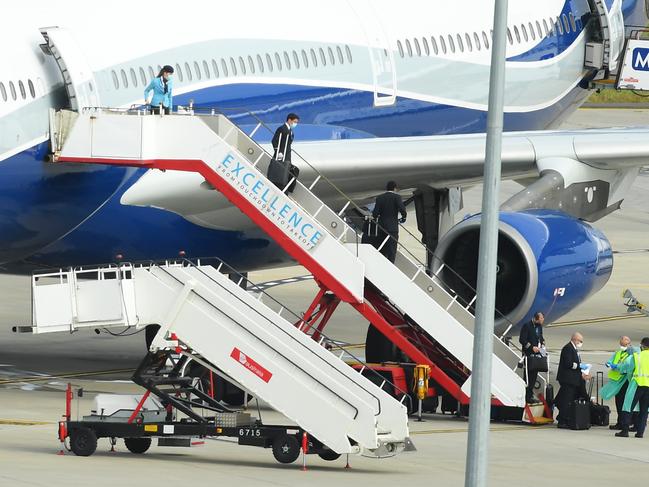 The flight crew of the chartered flight from Uruguay disembark the plane at Melbourne Airport. Picture: AAP