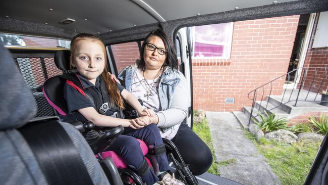 Kristi Deakin, who has arthritis, has had to to carry her wheelchair bound daughter Alexis, 6 years old up a flight of stairs for more than 3 years. They are desperately seeking a house that is wheelchair accessible but have been on the waitlist for three years. Picture Eddie Safarik