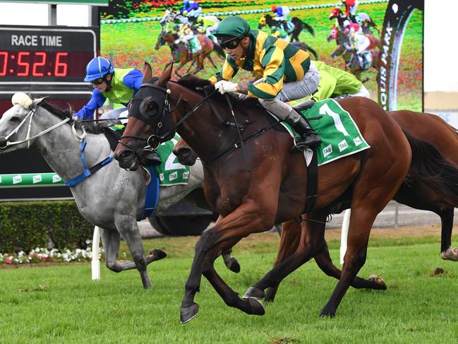 Jockey Jag Guthmann-Chester (right) rides Allround-Glory to victory in race three the McCain Foods Handicap during the QTIS Jewel Raceday at Aquis Park on the Gold Coast, Saturday, March 16, 2019, (AAP Image/Darren England.